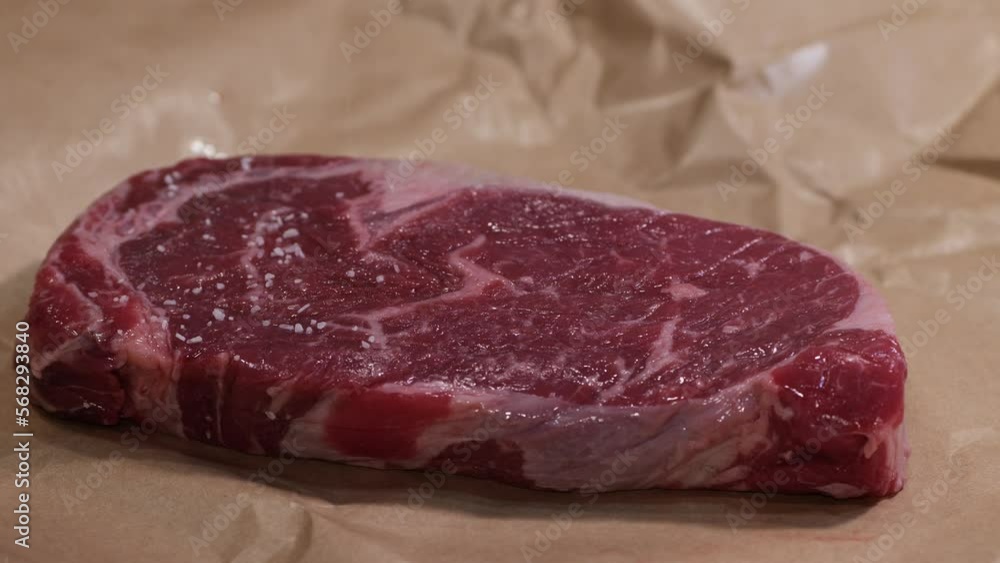 Covering a large ribeye steak with salt before cooking Covering a large ribeye steak with salt before cooking