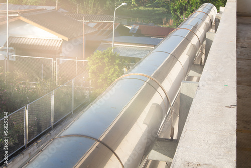 energy pipeline with sunlight shining on the side of the building
