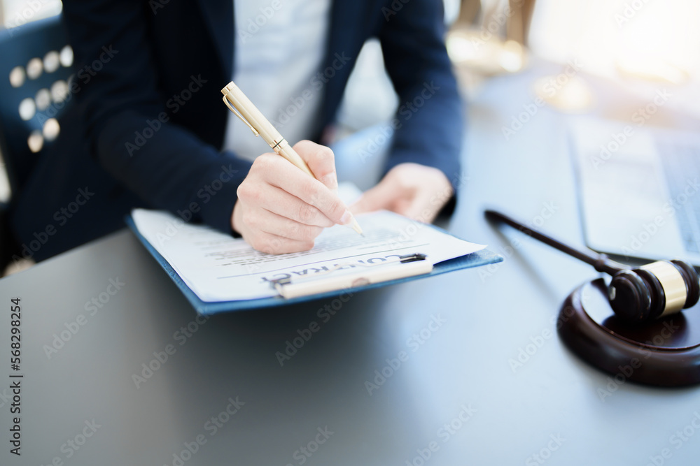 Portrait of a Asian woman lawyer studying a lawsuit for a client before going to court - obrazy, fototapety, plakaty 