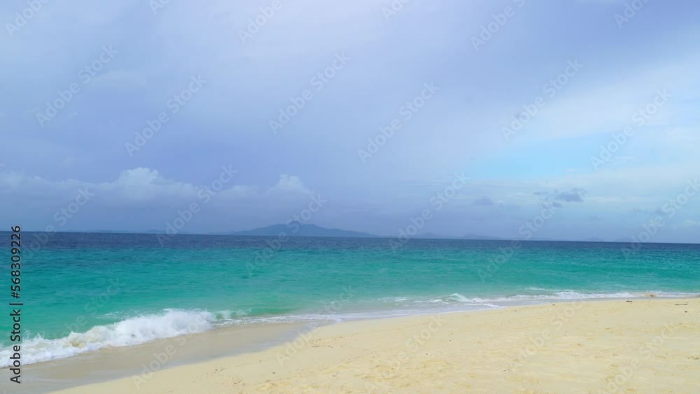Sand with blurred ocean water wave tropical beach bokeh background, summer vacation and travel concept with copy space, Thailand Sand with blurred ocean water wave tropical beach bokeh background, summer vacation and travel concept with copy space, Thailand
