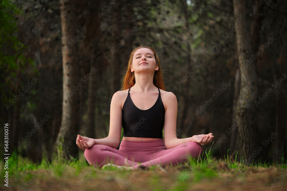 custom made wallpaper toronto digitalRedhead young woman meditating in a forest. Meditation in nature.