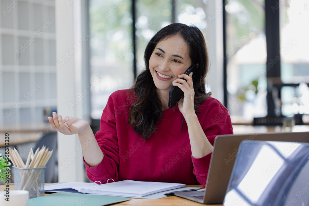 young asian business woman sitting and laptop in office workplace, business accounting and financial planning concept. young asian business woman sitting and laptop in office workplace, business accounting and financial planning concept.
