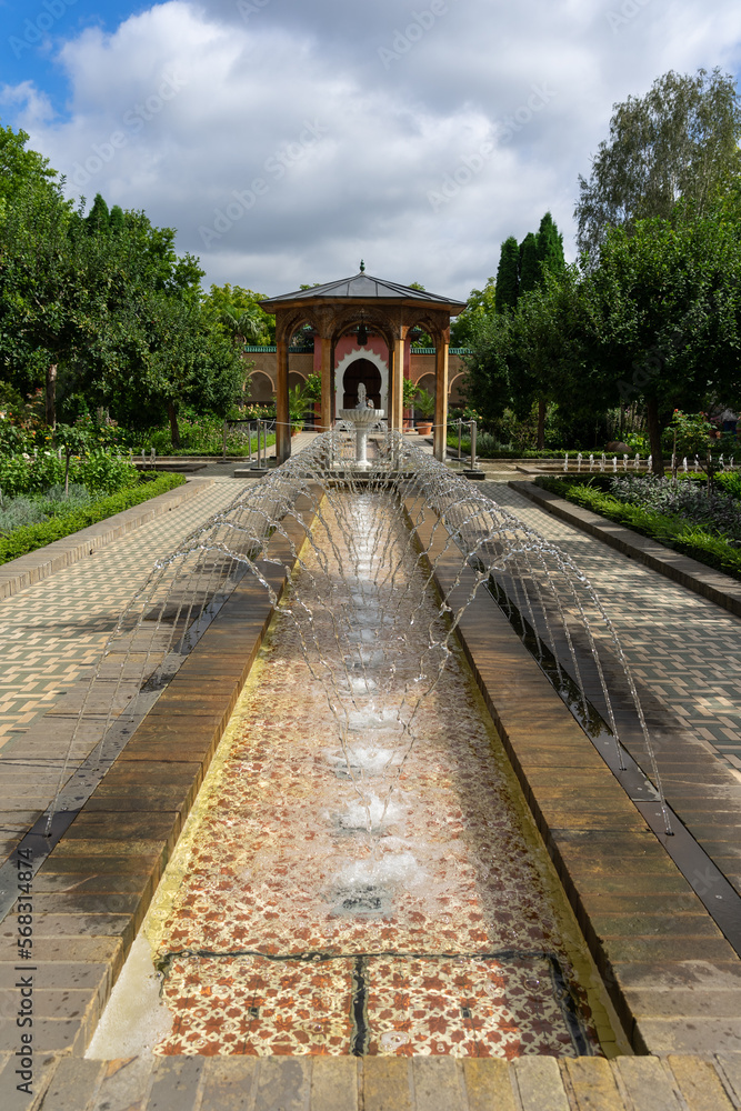 Traditional courtyard of a Moroccan garden. A number of small fountains.