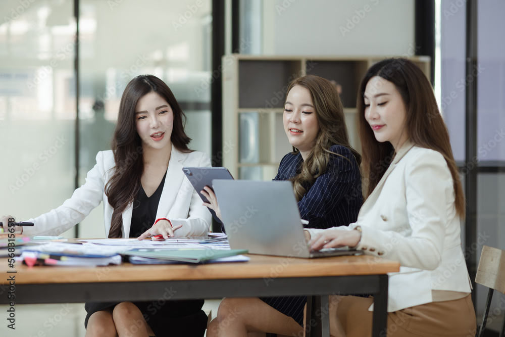Group of young Asian business woman teamwork and presenting new projects in the office. Group of young Asian business woman teamwork and presenting new projects in the office.