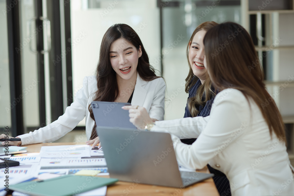 Group of young Asian business woman teamwork and presenting new projects in the office.