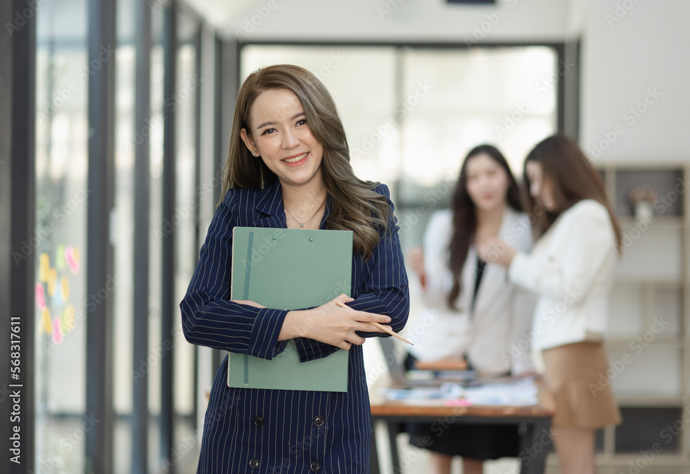 Fototapeta premium Group of young Asian business teamwork and presenting new projects in the office.