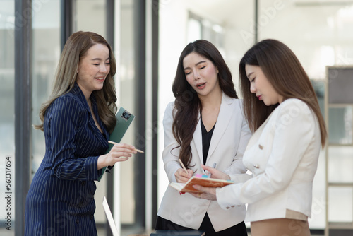 Group of young Asian business teamwork and presenting new projects in the office.