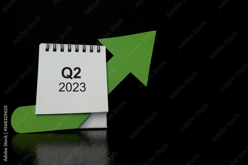 Second quarter of 2023 positive growth performance financial report and fiscal concept. Upward arrow with increasing coins and calendar in black background.
