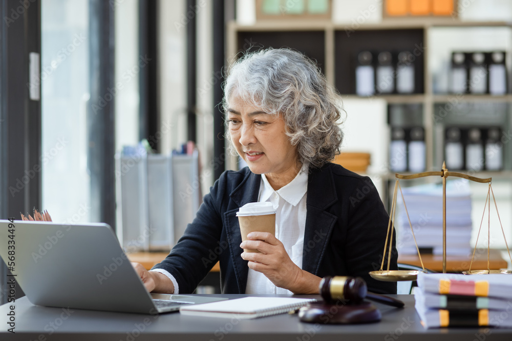 Asian lawyer woman working at law office desk, law firms, advice and justice concept. Asian lawyer woman working at law office desk, law firms, advice and justice concept.