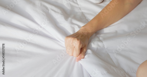 woman hand grasping sheets
