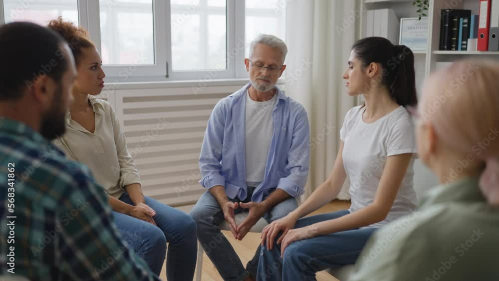 Man with mental health issues sharing his problem during support group meeting Man with mental health issues sharing his problem during support group meeting