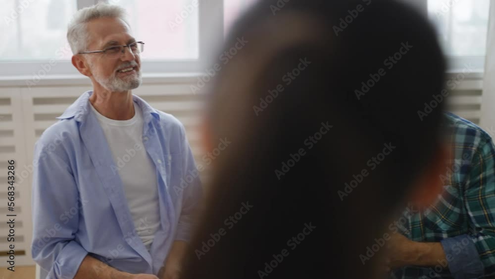 Multiethnic group of people sharing their problems during support group meeting Multiethnic group of people sharing their problems during support group meeting