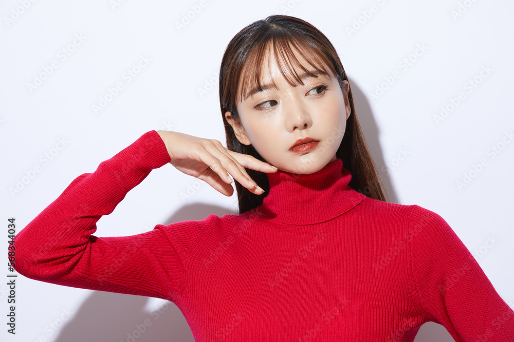 赤いニットを着た若い女性のビューティー ポートレート 赤いニットを着た若い女性のビューティー ポートレート