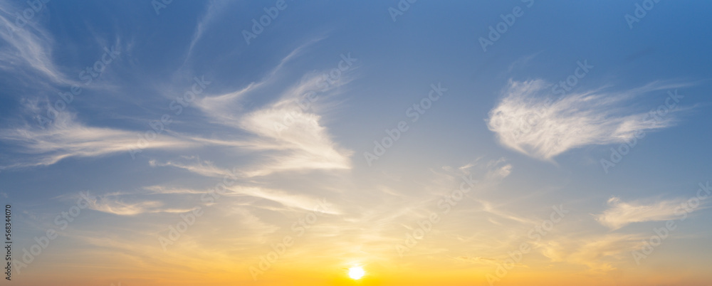 The yellow sun and white smooth cirrus clouds on blue sky, nature panorama background. The yellow sun and white smooth cirrus clouds on blue sky, nature panorama background.