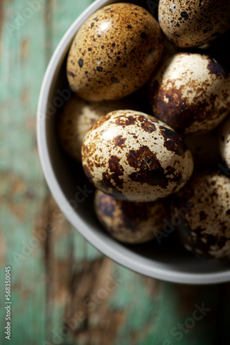 Quail eggs on a wooden table.