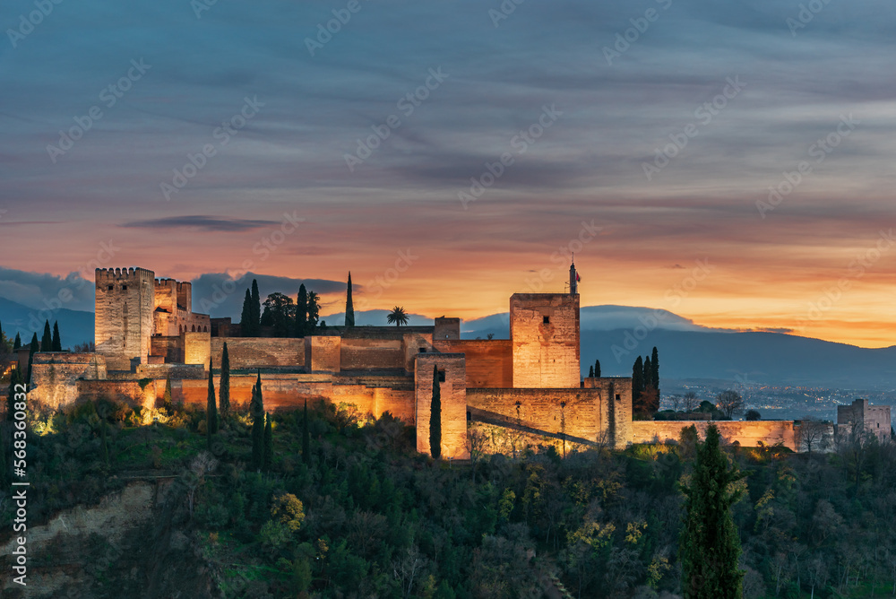 The Alhambra from the San Nicolas viewpoint with artificial lighting at sunset, Granada.