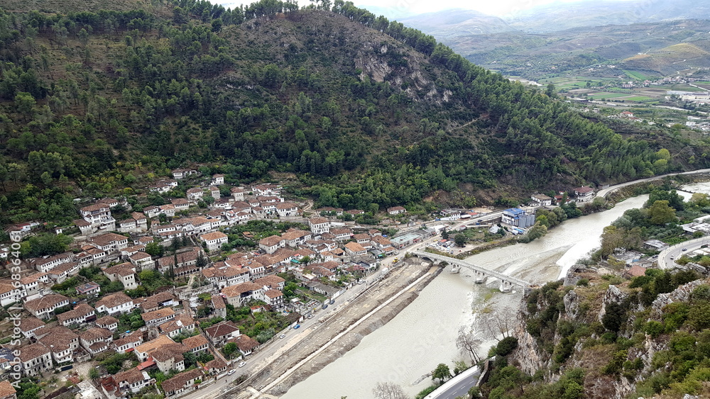 Berat is a city on the Osum River in central Albania. It is famous for the white Ottoman houses and for the castle of Berat, a huge complex on the hill where some citizens now reside. inside its walls