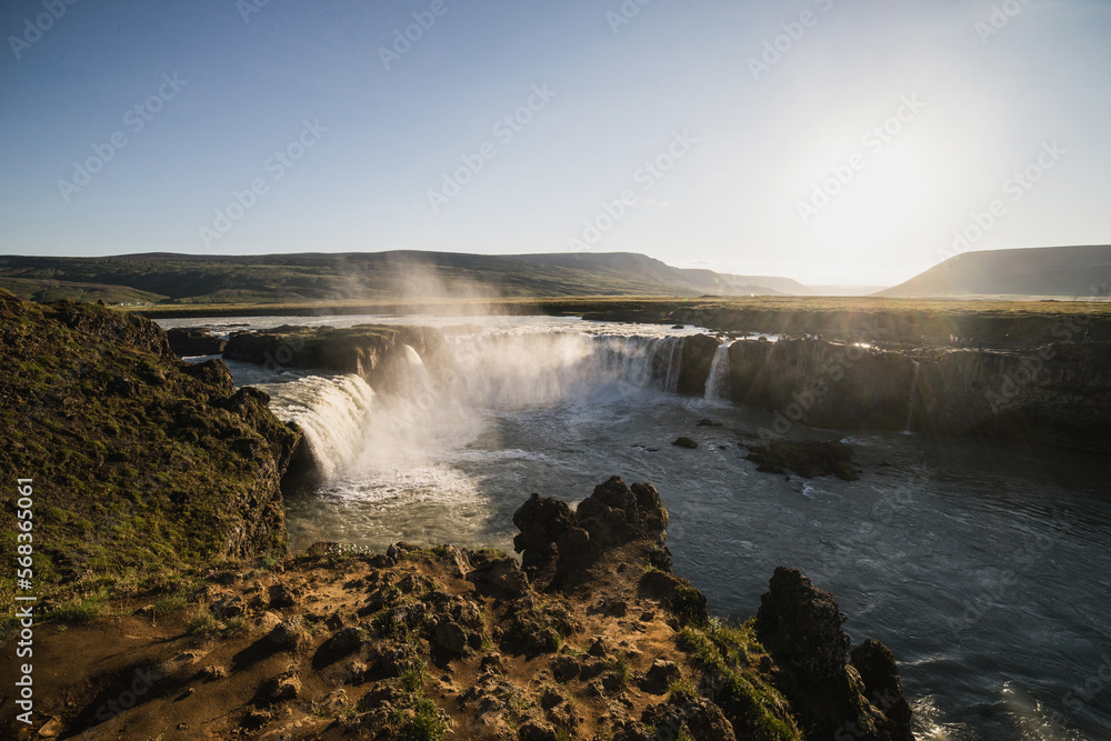 waterfall in iceland with the sunset waterfall in iceland with the sunset