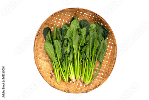 Fresh spinach in bamboo weave plate