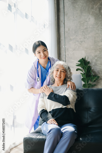 Senior woman being examined by a doctor in background