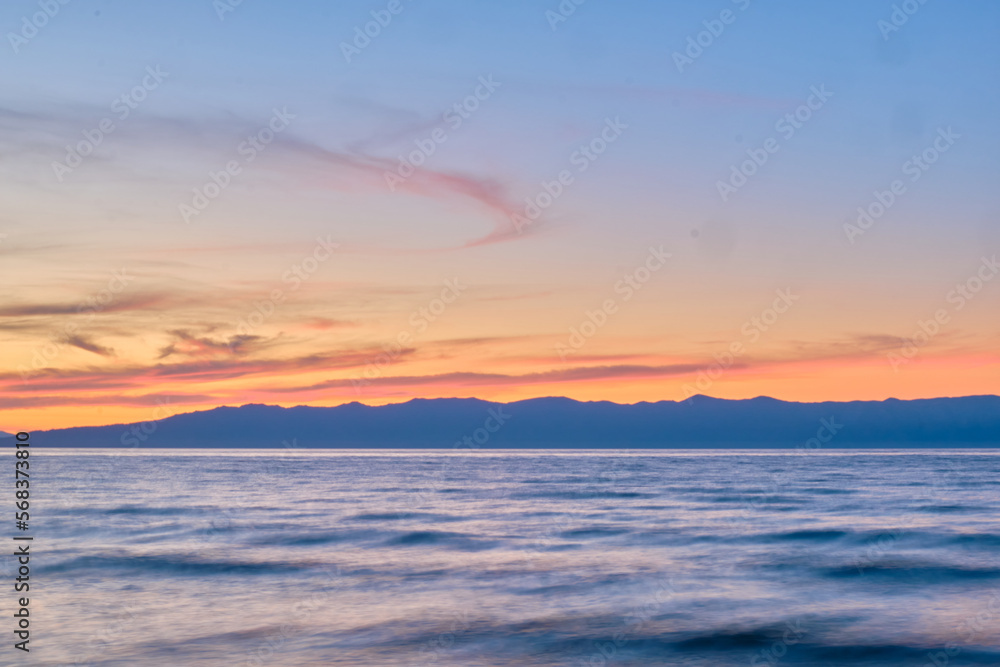 Sunset on Lake Baikal in the Barguzin Bay. Republic of Buryatia, Maksimikha settlement.
