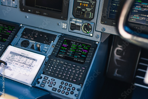 Closeup cockpit view of the pilots instruments and computers in flight