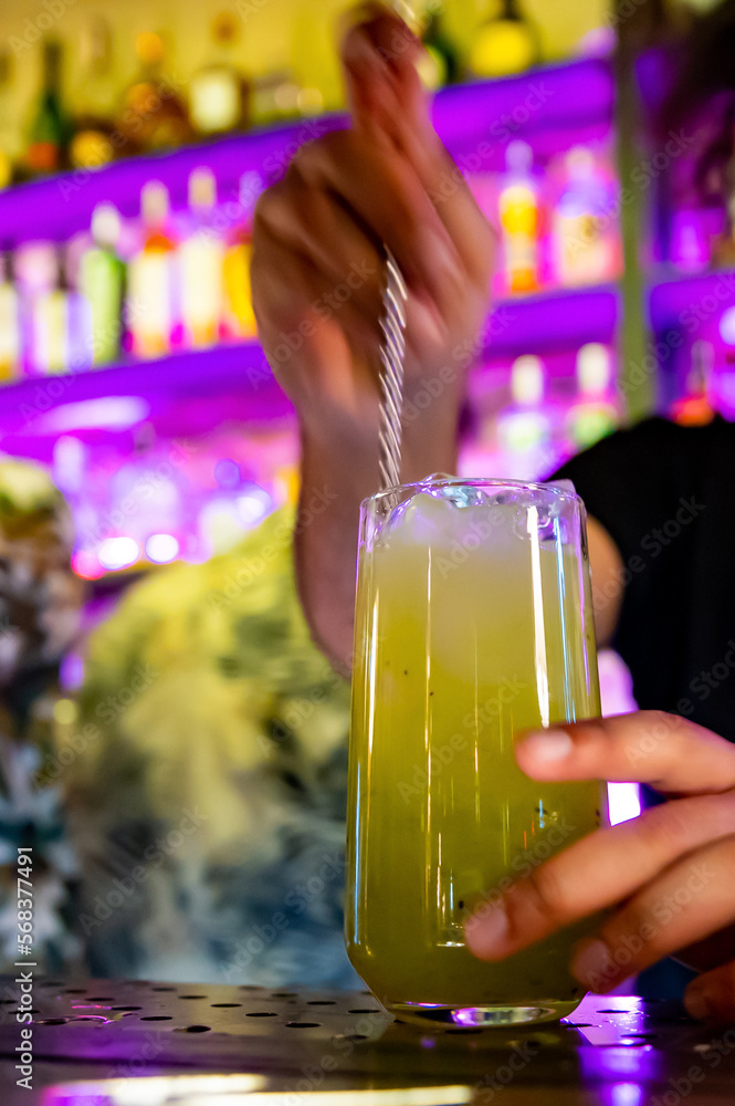 bartender making lemonade in a nightclub bar bartender making lemonade in a nightclub bar