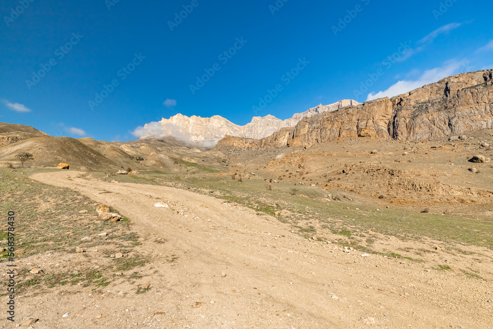 A road in the mountains. The road to the Bezengi gorge. Nature of Russia Caucasus. Off-road in the mountains.