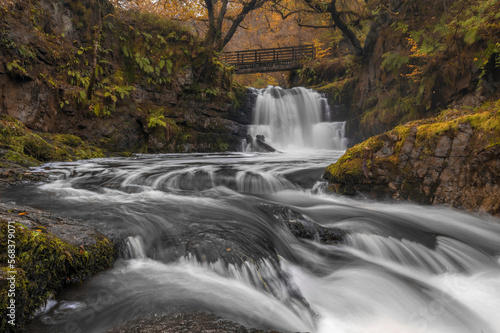 Sychryd Waterfall, in the Vale of Neath, Wales, in full flow during the autumn. 