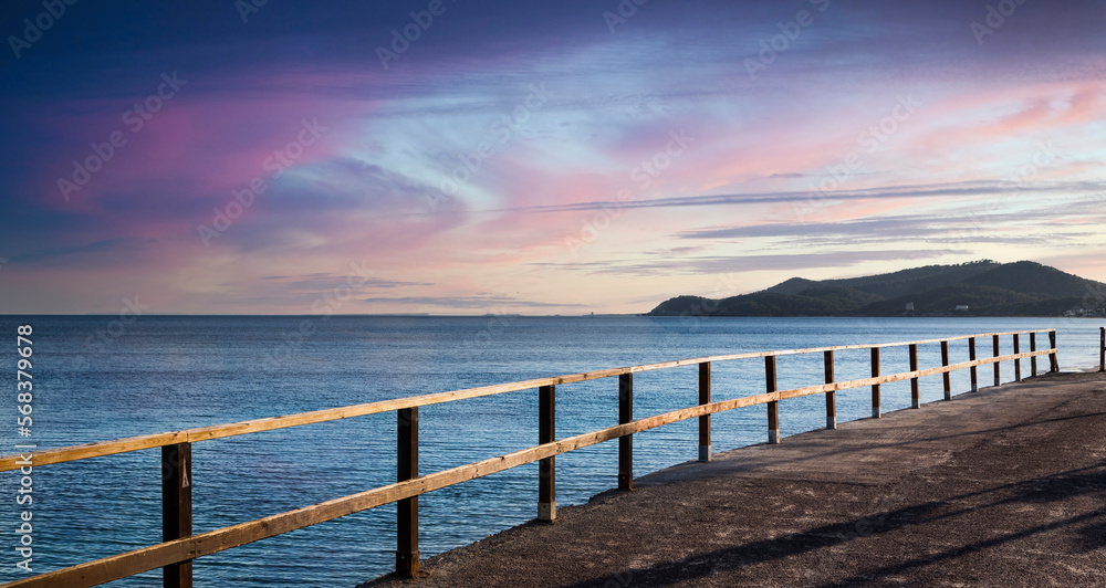 Obraz premium View of the sea at sunset from the coast on the island of Ibiza in Spain.