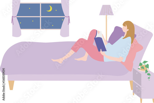 お休み前に読書をする女性