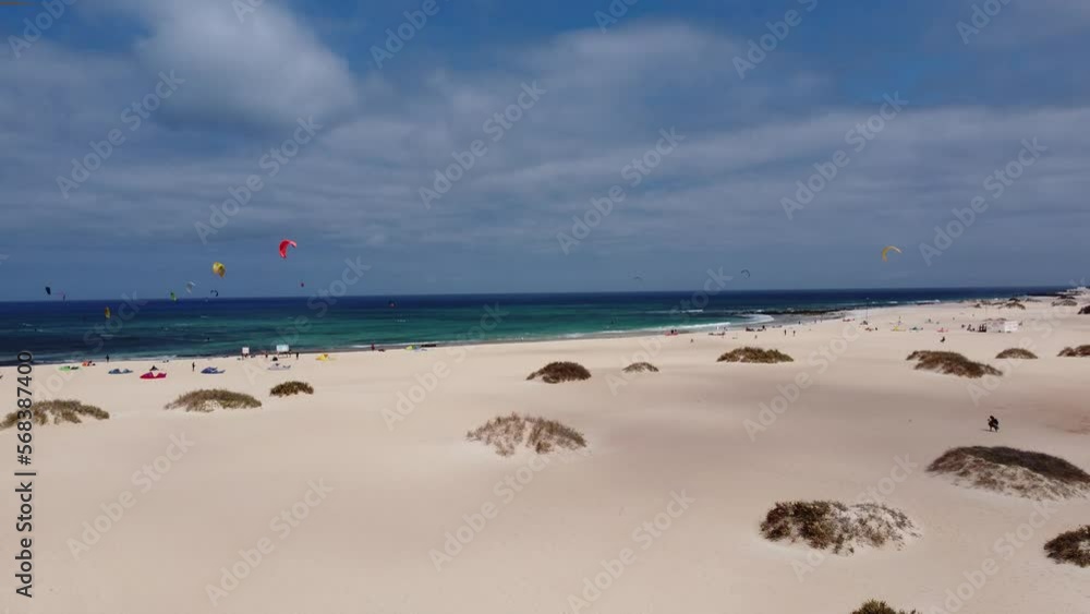 aerial view over the dunes of corralejo - fuerteventura - with many kitesurfing people