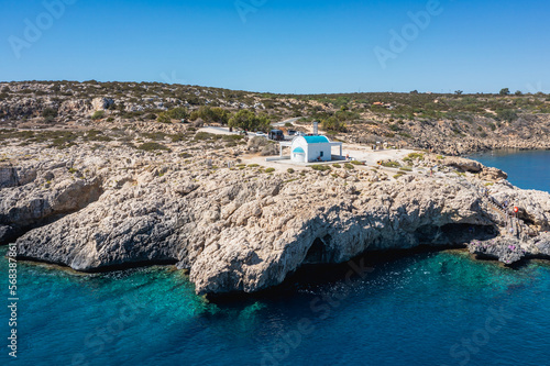 Drone photo of orthodox chapel of Ayioi Anargyroi in Cape Greco National Forest Park in Cyprus photo