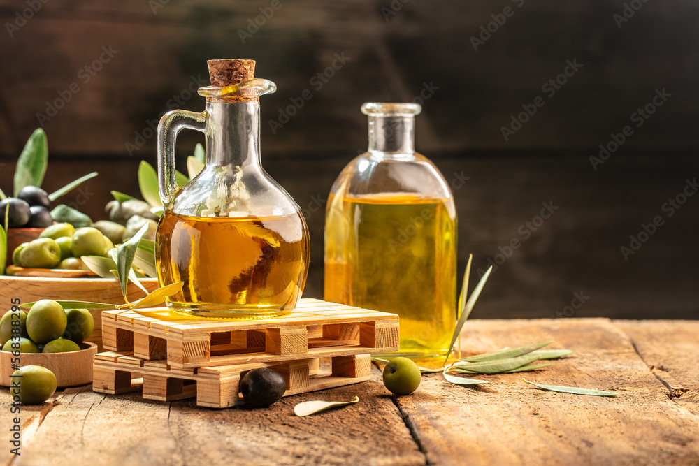 extra virgin olive oil in glass bottles on a wooden background. Healthy and detox food concept. place for text extra virgin olive oil in glass bottles on a wooden background. Healthy and detox food concept. place for text