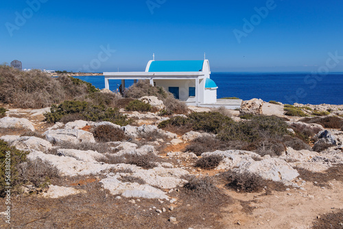 Small orthodox chapel of Ayioi Anargyroi in Cape Greco National Forest Park in Cyprus photo