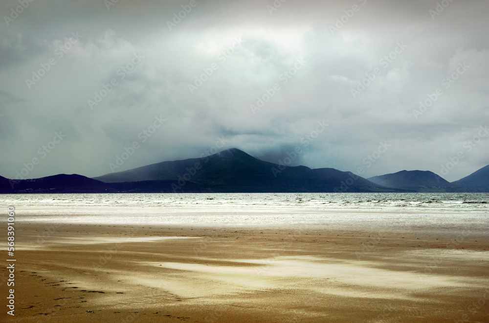 Inch Strand, County Kerry, Ireland. Looking south across Dingle Bay toward the mountains of the Ring of Kerry. Stormy weather Inch Strand, County Kerry, Ireland. Looking south across Dingle Bay toward the mountains of the Ring of Kerry. Stormy weather