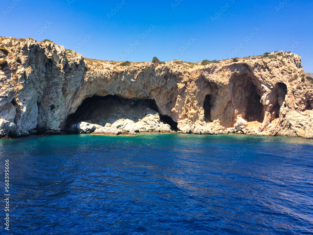 The cave called Karakoyuk after Palamutbuku on the Mediterranean side in Muğla Datca, Turkey. View from the cliffs down to a picturesque sea bay with cave.
