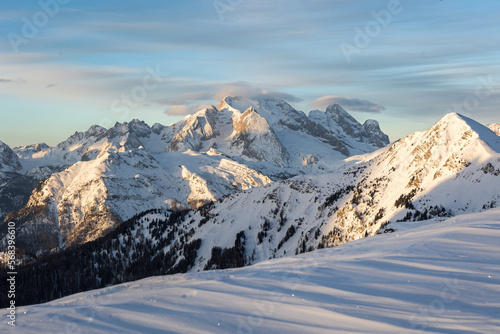 winter sunrise over snow covered mountain - Marmolada in Dolomites  photo