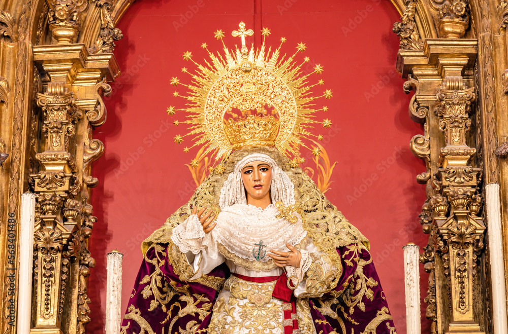 Obraz premium Image of the Virgen de la Esperanza de Triana inside the Capilla de los Marineros (Chapel of the Sailors) in the Triana neighborhood, Seville, Andalusia, Spain