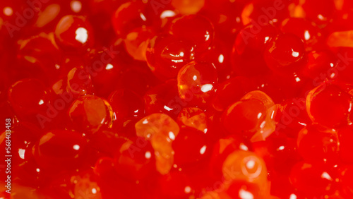 Texture of red caviar. Salmon caviar grainy. Close up.