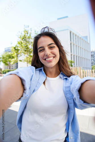 Konstfotografi Vertical selfie of a Young beautiful woman smiling at university campus
