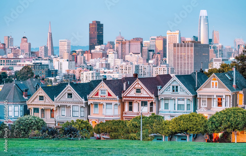 Painted Ladies Victorian houses in Alamo Square and a view of the San Francisco skyline and skyscrapers. Photo processed in pastel colors