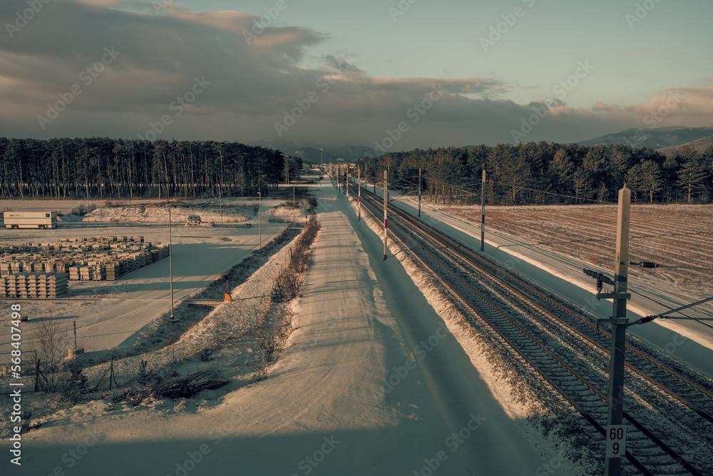 railway in winter in the morning in austria