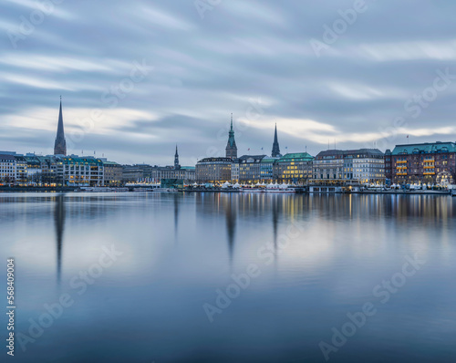 Hamburg city centre illuminated with lights on lake Binnenalster during christmas, Germany