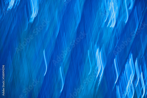 abstract blue background with some smooth lines in it and some motion blur