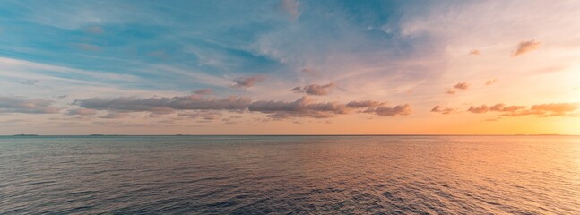 Panoramic sea skyline beach. Amazing sunrise beach landscape. Panorama of tropical beach seascape horizon. Abstract colorful sunset sky light tranquil relax summer seascape freedom wide angle seascape