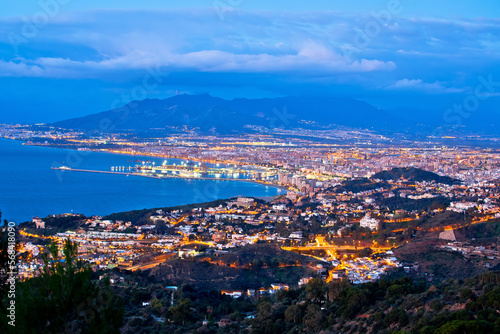 Malaga city and coastline aerial panoramic dawn view