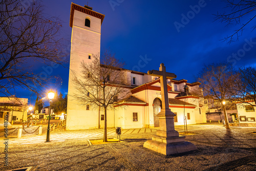 Ancient church and square in historic Albayzin hood of Granada photo
