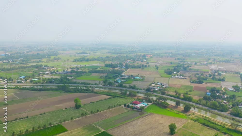 Aerial top view of fresh paddy rice, green agricultural field in countryside or rural area in Asia. Nature landscape background. Aerial top view of fresh paddy rice, green agricultural field in countryside or rural area in Asia. Nature landscape background.
