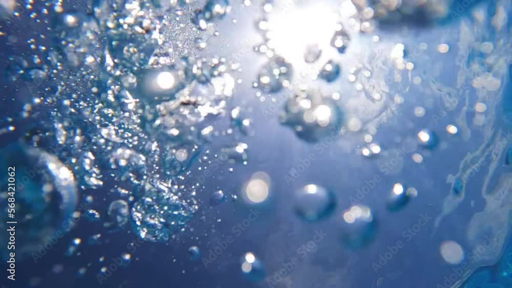 Underwater slow motion video of deep blue air bubbles released in jacuzzi spa creating perfect relaxing treatment for well being Underwater slow motion video of deep blue air bubbles released in jacuzzi spa creating perfect relaxing treatment for well being